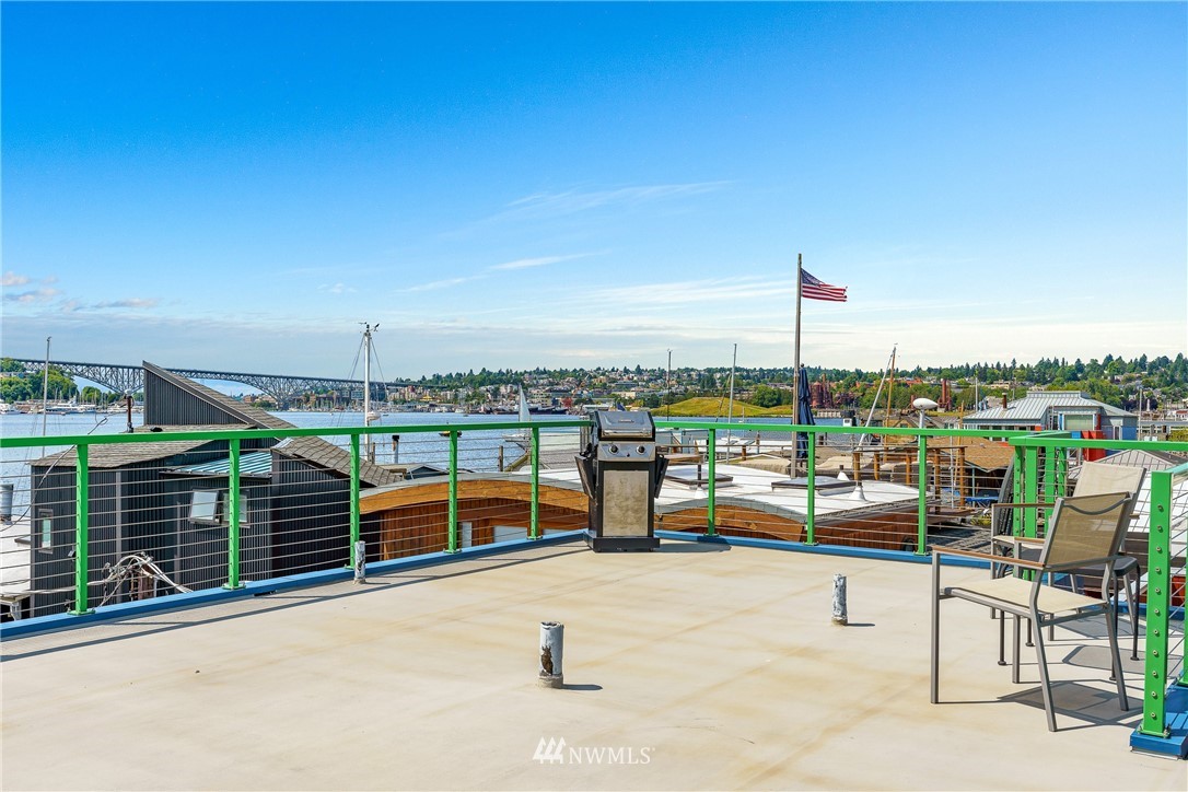 2031 Fairview Avenue East, Unit E Seattle, WA 98102 - Photo 23 of 32 a view of roof deck with seating space and barbeque oven
