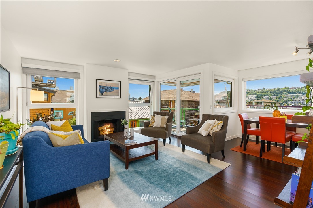 2031 Fairview Avenue East, Unit E Seattle, WA 98102 - Photo 5 of 32 a living room with furniture fireplace and a large window