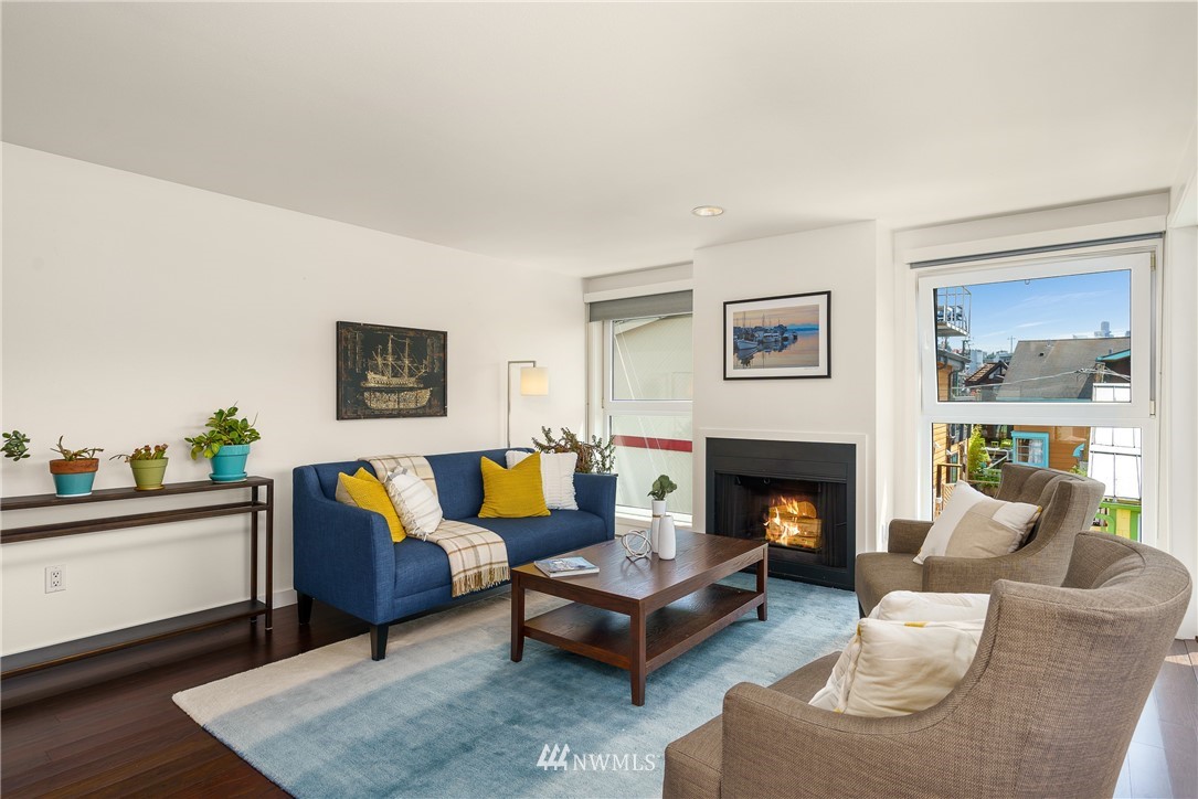 2031 Fairview Avenue East, Unit E Seattle, WA 98102 - Photo 7 of 32 a living room with furniture and a fireplace