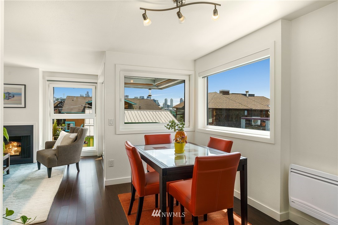 2031 Fairview Avenue East, Unit E Seattle, WA 98102 - Photo 8 of 32 a view of a dining room with furniture window and wooden floor
