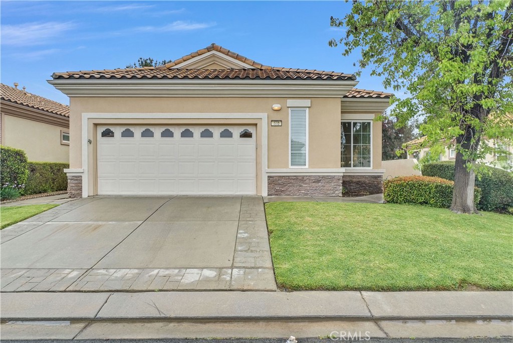 440 Brooklawn Drive Banning, CA 92220 - Photo 1 of 1 a front view of a house with garden