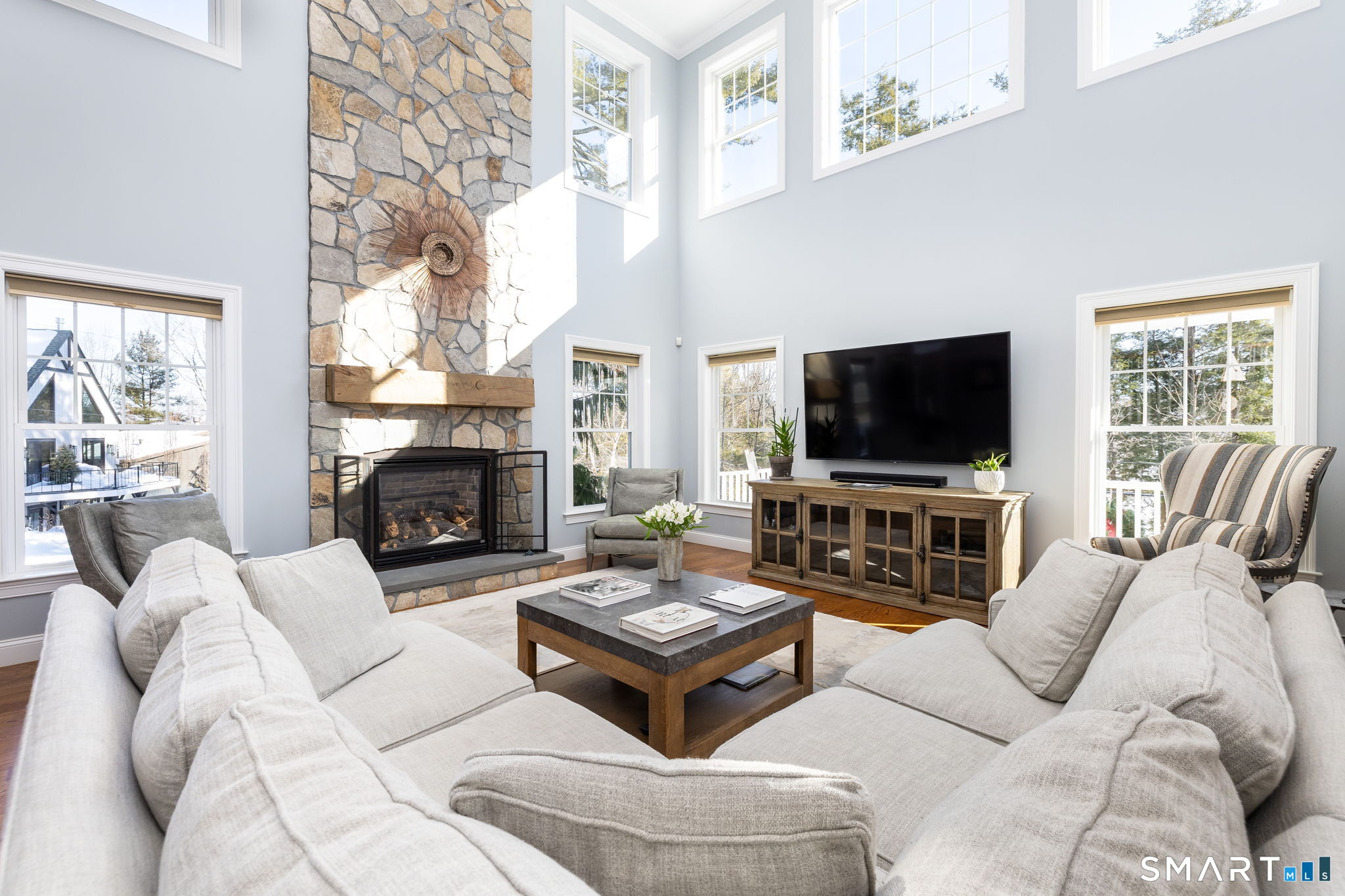 7 Hill Top Road Morris, CT 06763 - Photo 5 of 43 a living room with furniture a fireplace and a flat screen tv