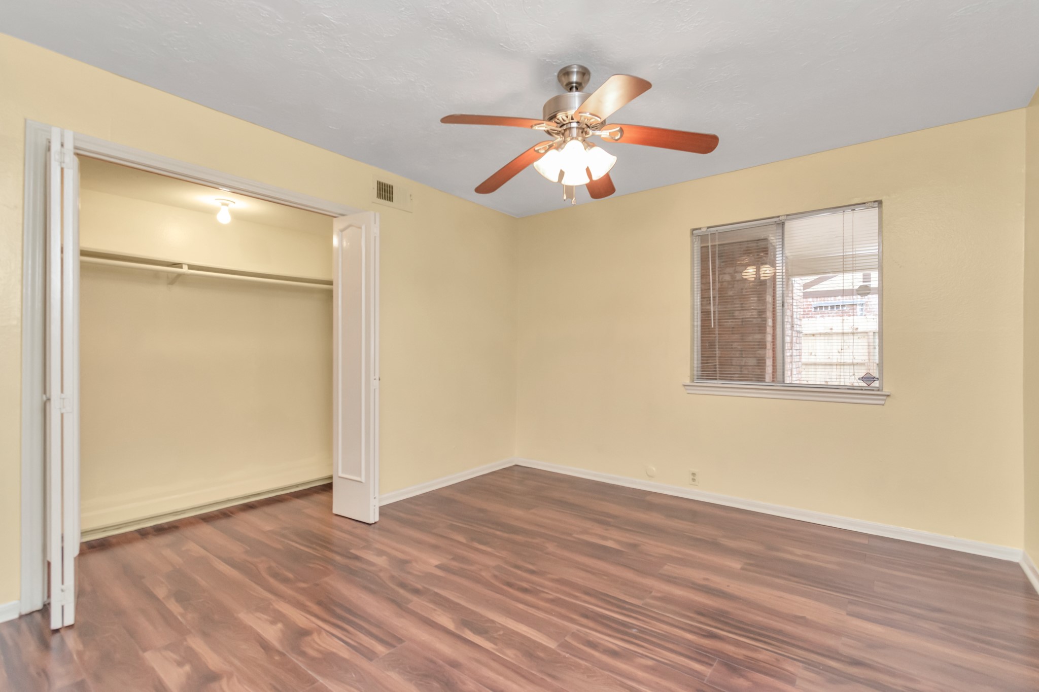 4702 Cashel Circle, Unit B Houston, TX 77069 - Photo 20 of 34 a view of an empty room with wooden floor and a window