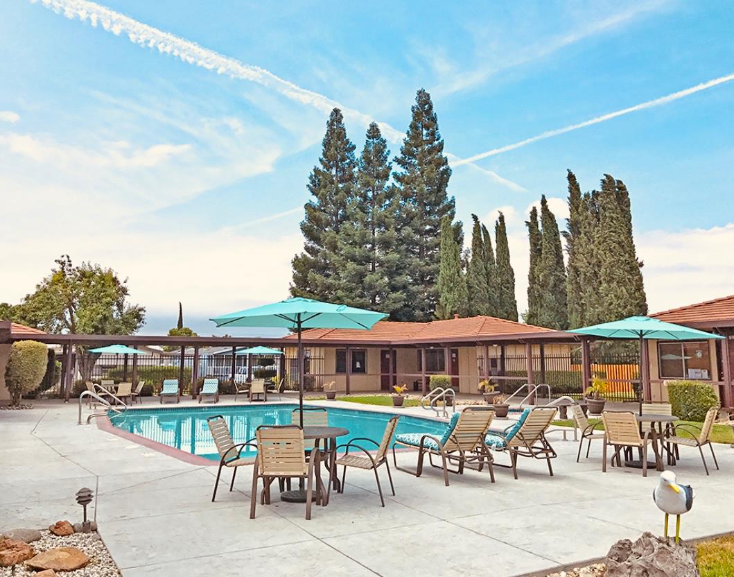 195 Schooner Lane Modesto, CA 95356 - Photo 21 of 24 a view of a chairs and table in the terrace