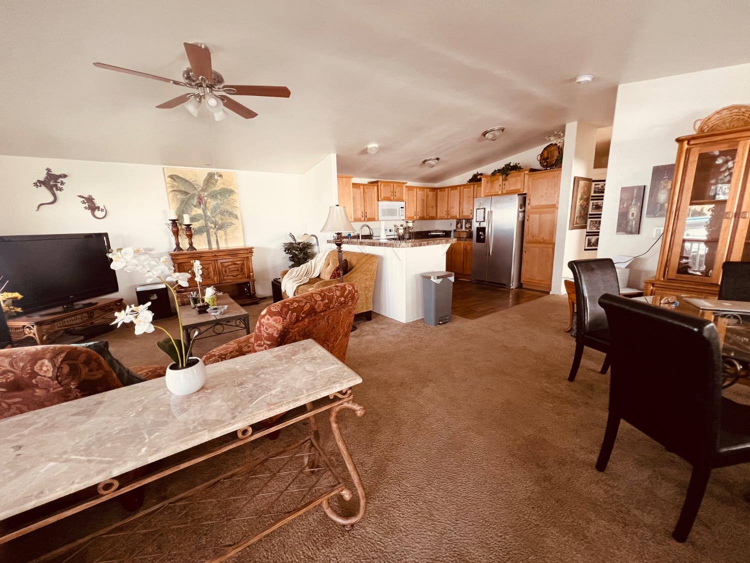 195 Schooner Lane Modesto, CA 95356 - Photo 9 of 24 a living room with furniture and a flat screen tv