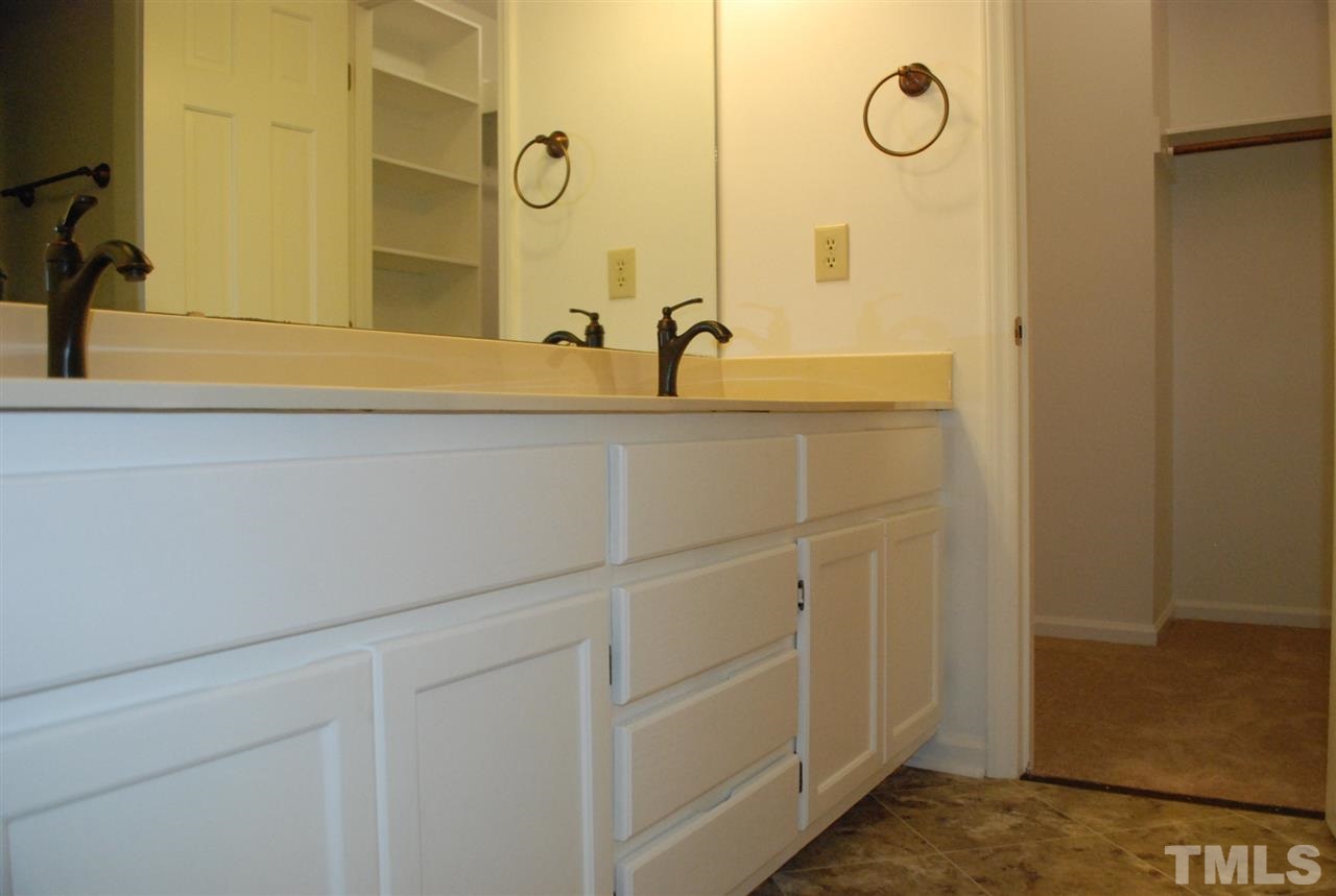 4301 Hopson Drive Raleigh, NC 27604 - Photo 14 of 23 a bathroom with a sink and mirror