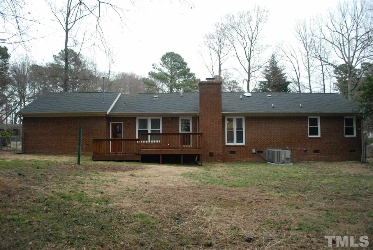 4301 Hopson Drive Raleigh, NC 27604 - Photo 22 of 23 a house that has a tree in front of it