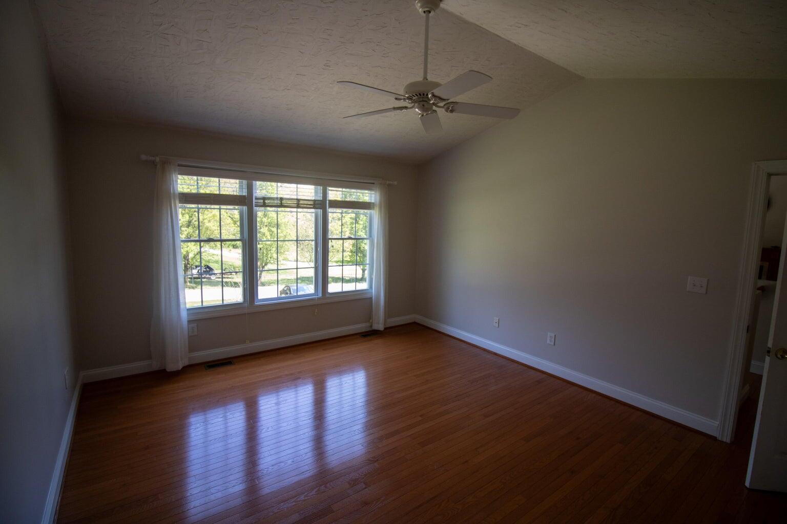 3727 Chaparral Drive Roanoke, VA 24018 - Photo 12 of 24 a view of an empty room with wooden floor and a window