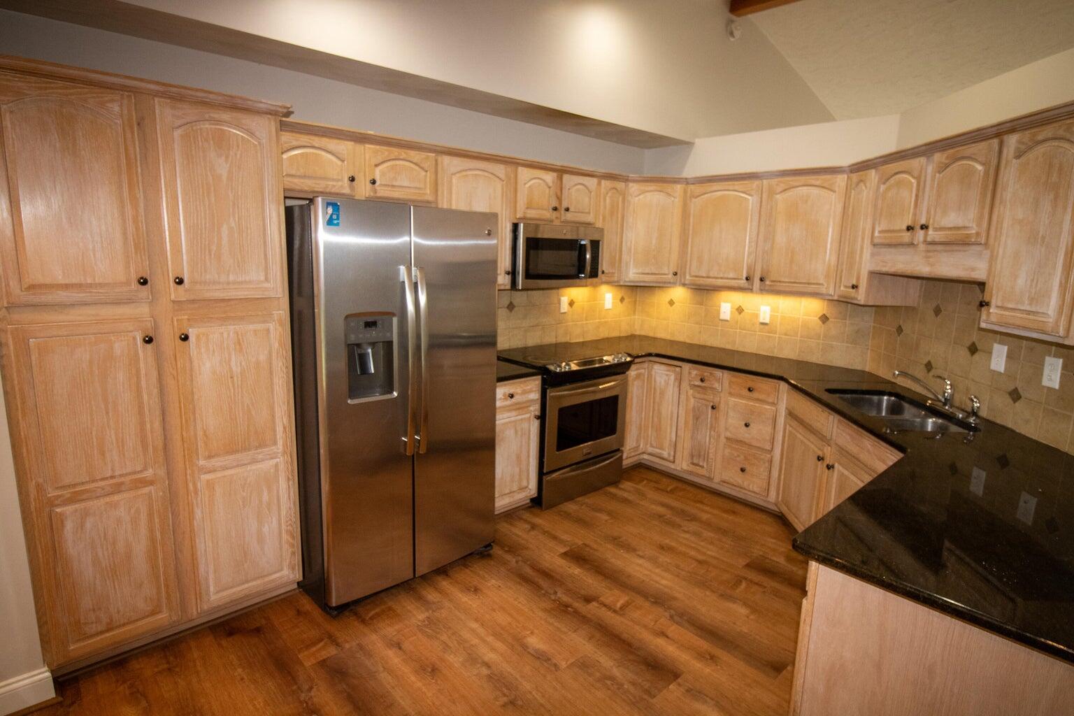 3727 Chaparral Drive Roanoke, VA 24018 - Photo 2 of 24 a kitchen with stainless steel appliances granite countertop a refrigerator a sink and dishwasher