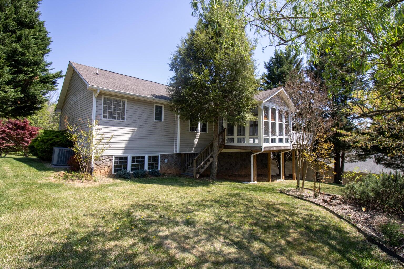3727 Chaparral Drive Roanoke, VA 24018 - Photo 24 of 24 a view of a house with a yard and sitting area