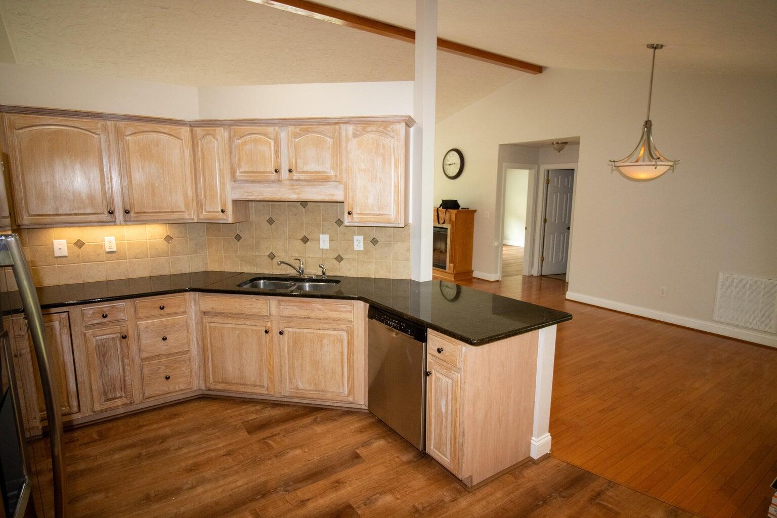 3727 Chaparral Drive Roanoke, VA 24018 - Photo 3 of 24 a kitchen with stainless steel appliances granite countertop a sink stove and cabinets