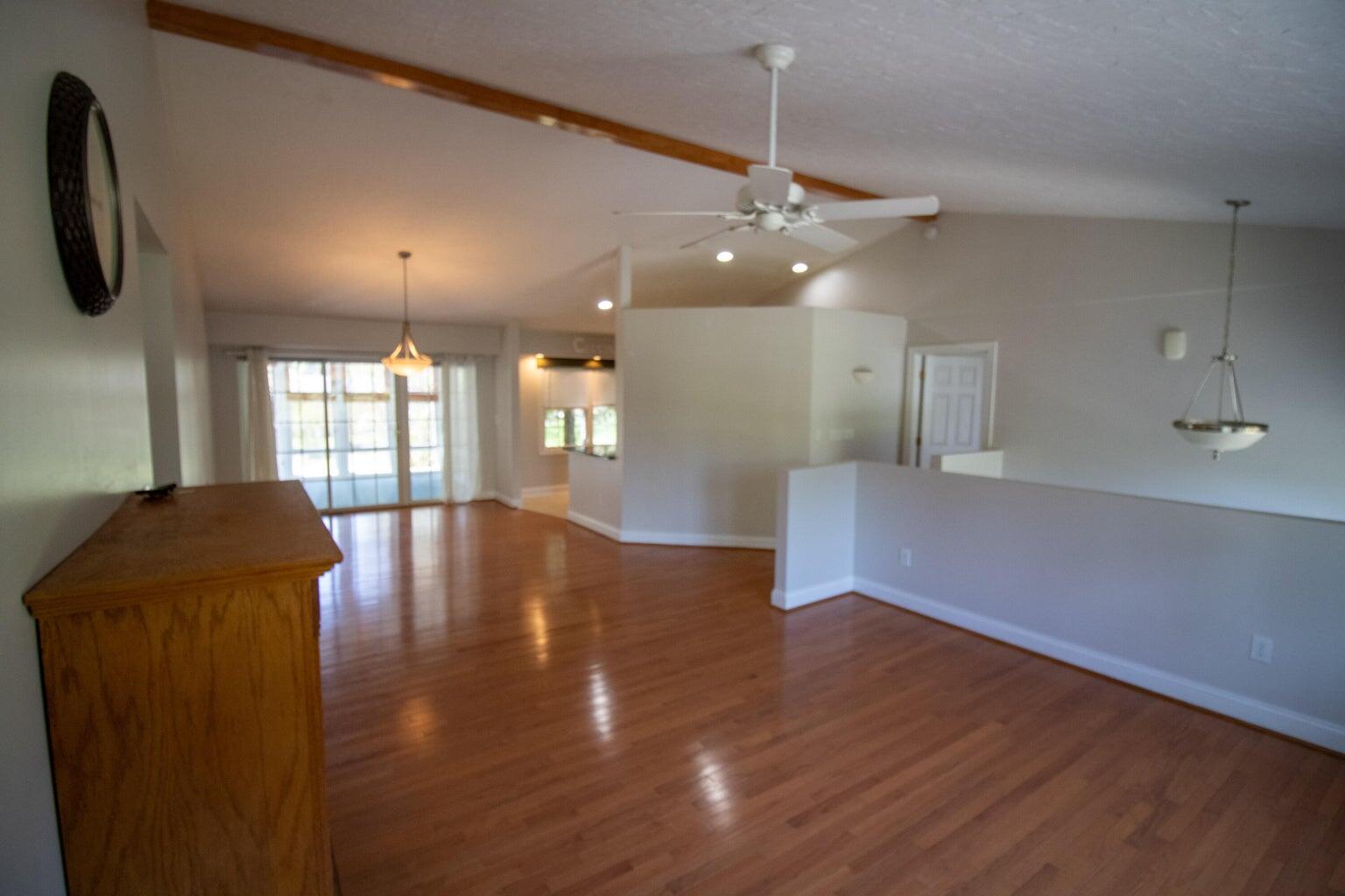 3727 Chaparral Drive Roanoke, VA 24018 - Photo 6 of 24 a view of an empty room with a window and wooden floor