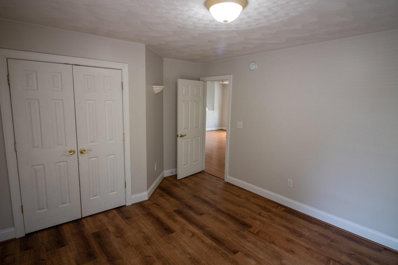 3727 Chaparral Drive Roanoke, VA 24018 - Photo 7 of 24 a view of an empty room with wooden floor