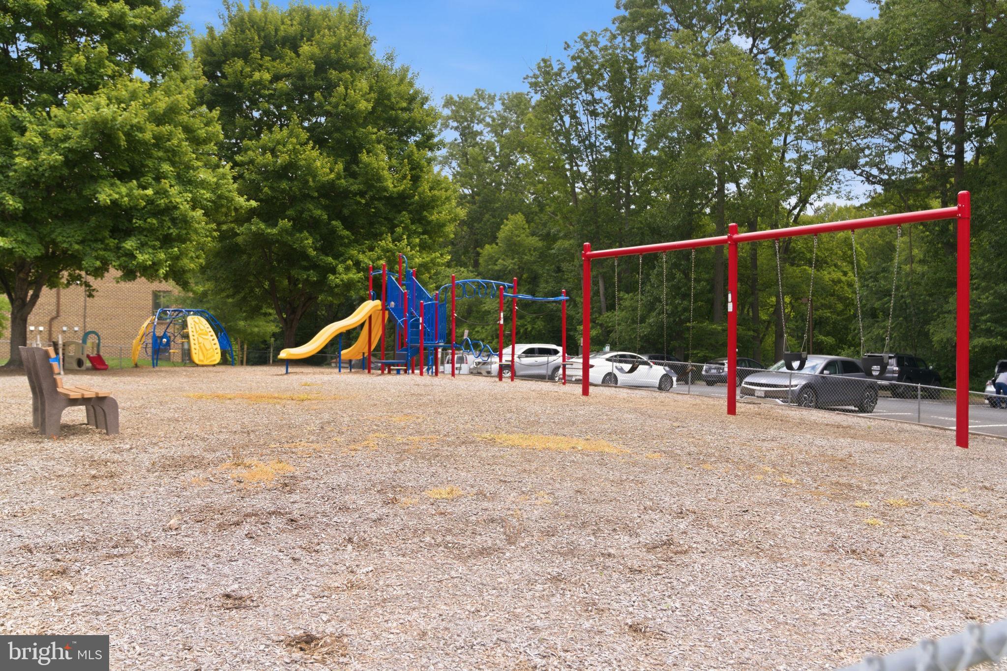 11260 Chestnut Grove Square, Unit 337 Reston, VA 20190 - Photo 62 of 82 Vibrant playground under blue skies.