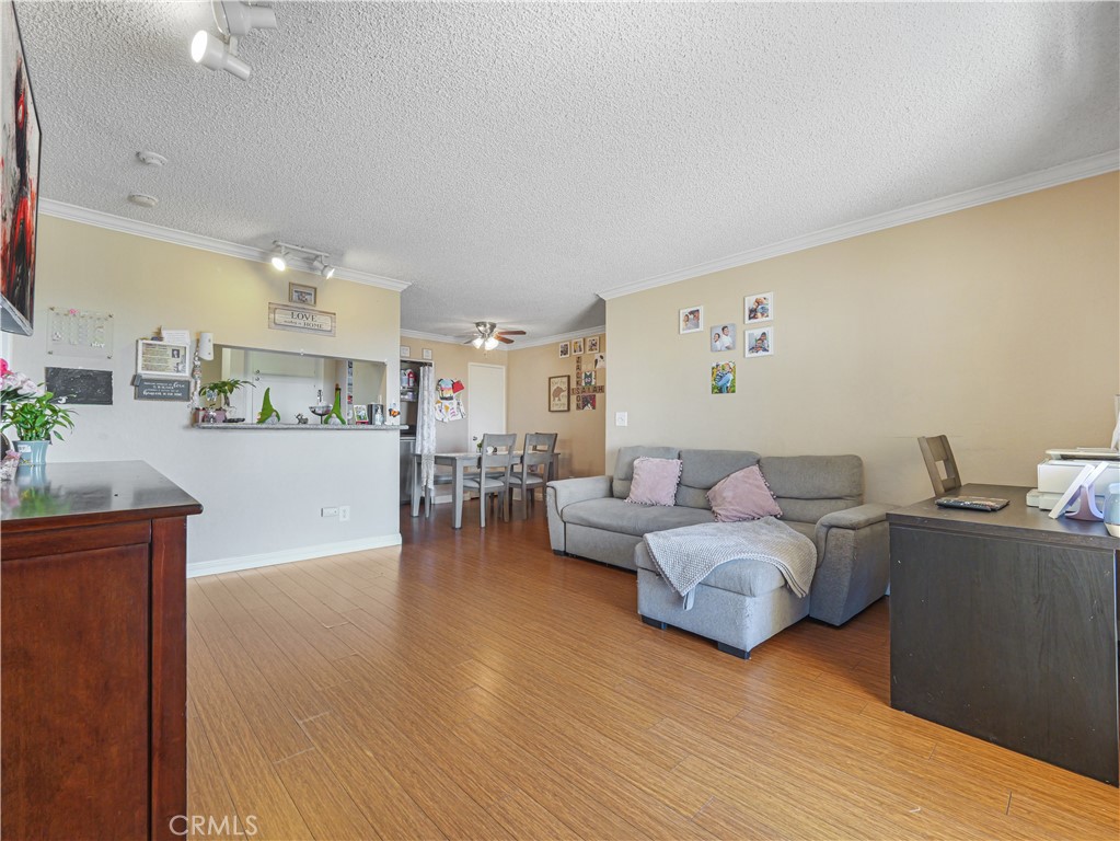 10655 Lemon Avenue, Unit 4009 Rancho Cucamonga, CA 91737 - Photo 3 of 15 a living room with furniture and wooden floor