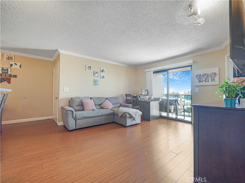 10655 Lemon Avenue, Unit 4009 Rancho Cucamonga, CA 91737 - Photo 4 of 15 a living room with furniture and a large window