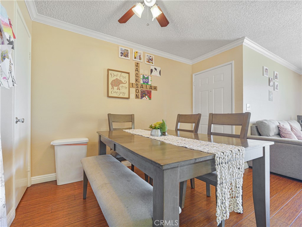 10655 Lemon Avenue, Unit 4009 Rancho Cucamonga, CA 91737 - Photo 7 of 15 a view of a dining room with furniture and wooden floor