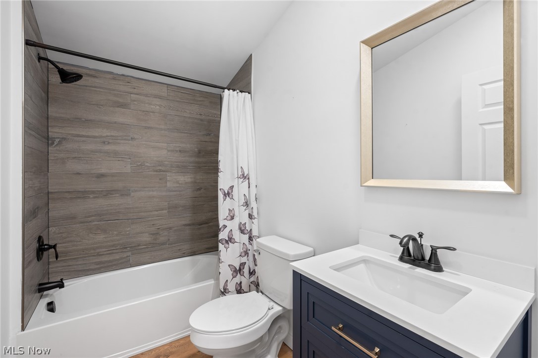 1617 Graham Road Stow, OH 44224 - Photo 44 of 49 Full bathroom featuring vanity, shower / bath combo, and toilet