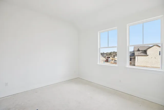 an empty room with windows