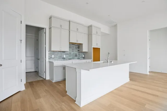 a view of kitchen with wooden floor