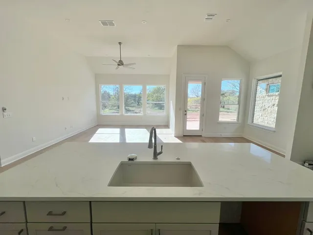 a bathroom with a sink and a window