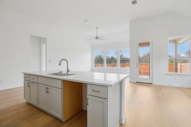 a kitchen with sink and window