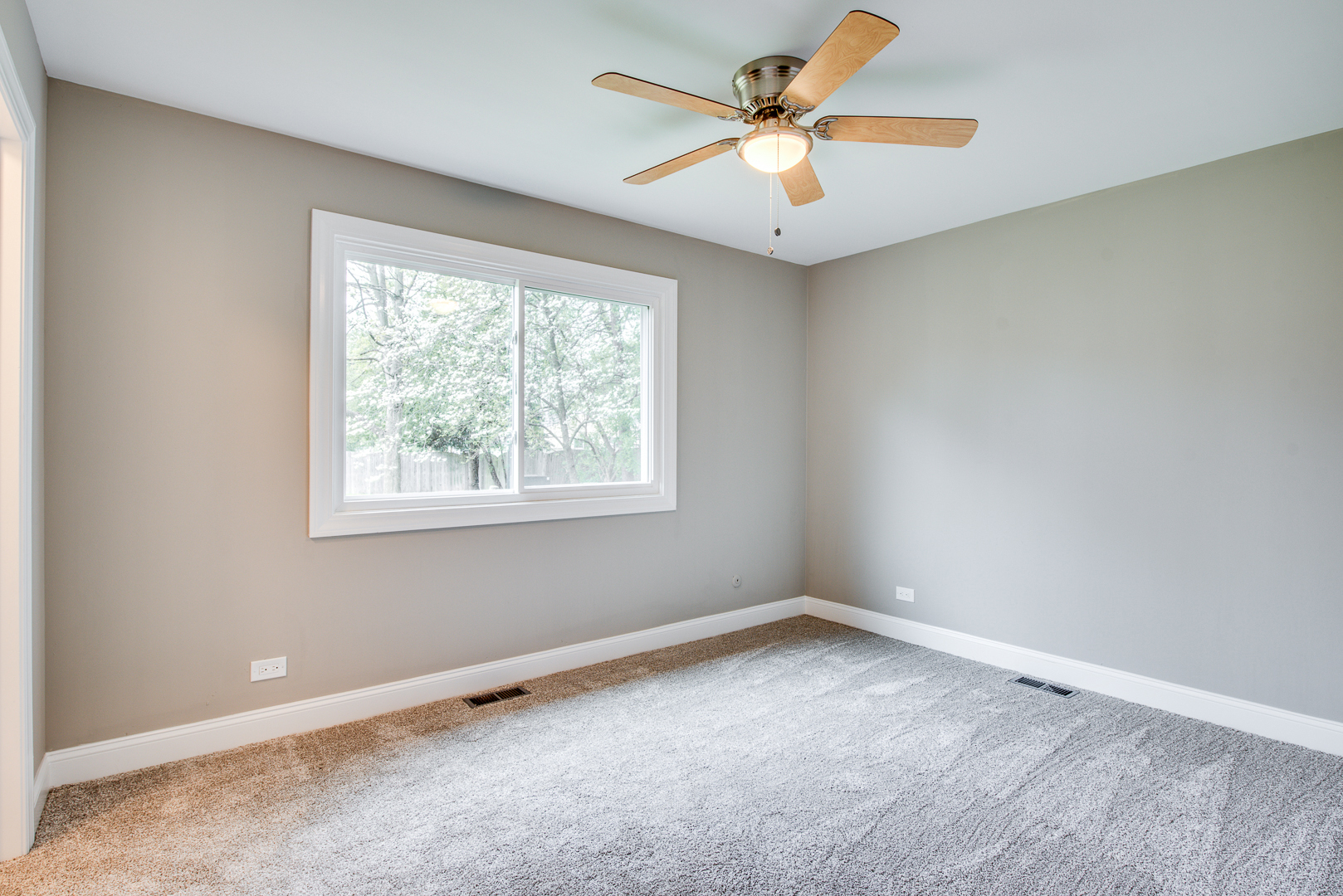 106 Foxcroft Road Naperville, IL 60565 - Photo 11 of 21 an empty room with a window