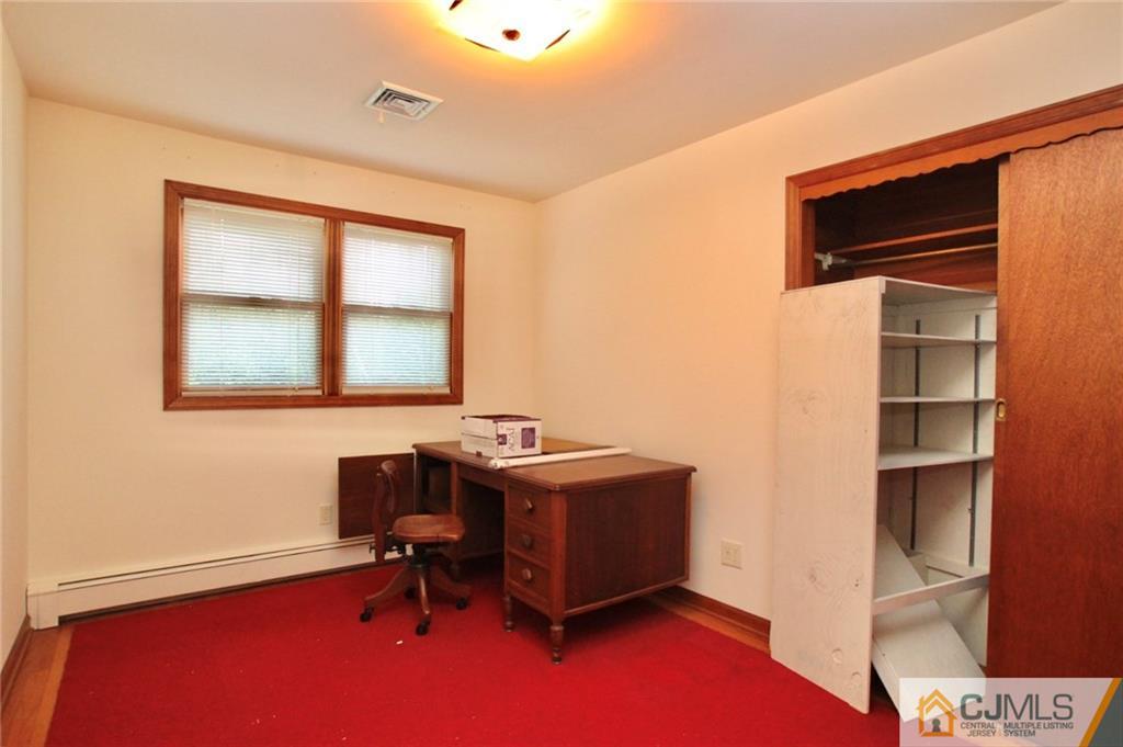 959 Ridge Road Princeton, NJ 08540 - Photo 14 of 25 a view of a workspace with furniture and a window