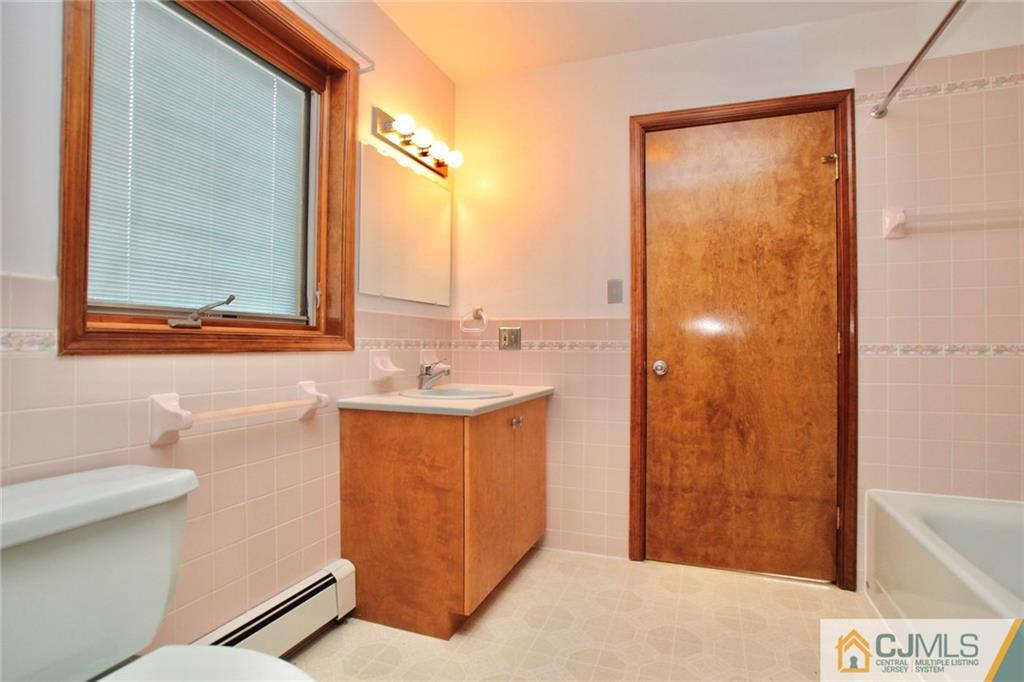 959 Ridge Road Princeton, NJ 08540 - Photo 17 of 25 a bathroom with a sink and a mirror