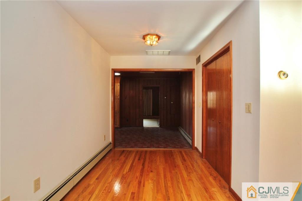959 Ridge Road Princeton, NJ 08540 - Photo 20 of 25 a view of a hallway with wooden floor and a ceiling fan