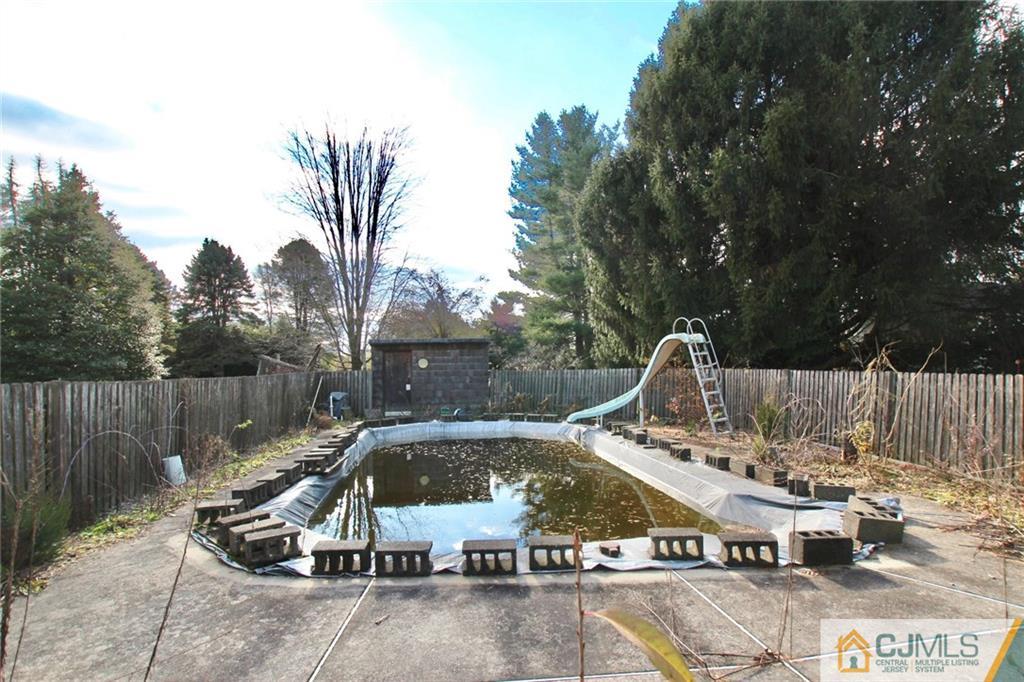 959 Ridge Road Princeton, NJ 08540 - Photo 4 of 25 a view of a swimming pool with a patio
