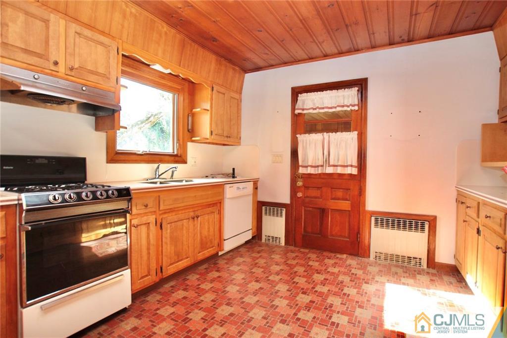 959 Ridge Road Princeton, NJ 08540 - Photo 8 of 25 a kitchen with stainless steel appliances granite countertop a stove a sink and a refrigerator