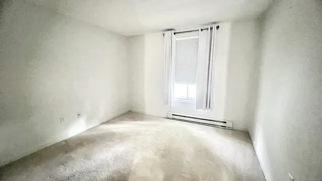 a bathroom with a shower and a sink