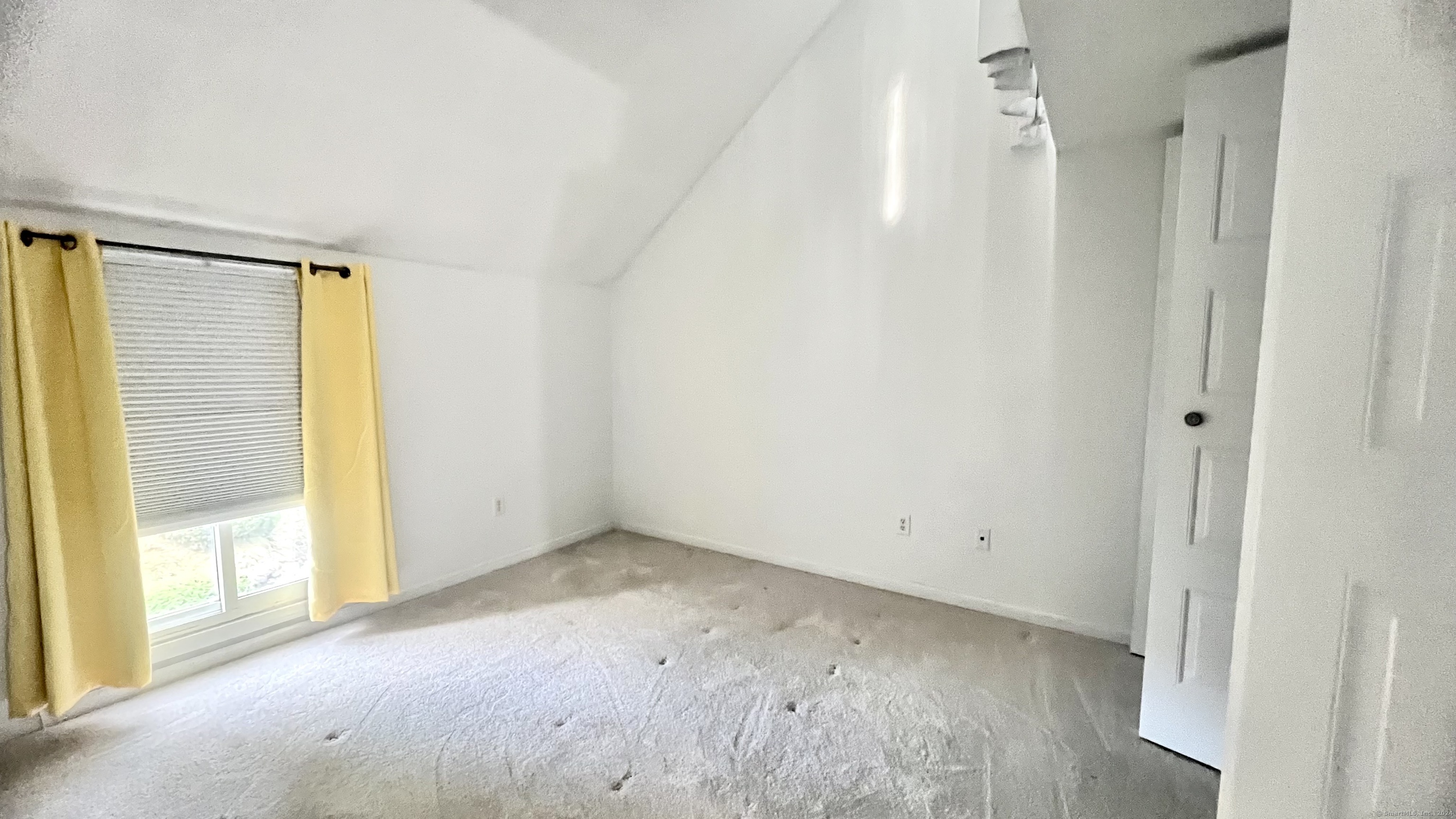 1 Cinnamon Spring, Unit 1 South Windsor, CT 06074 - Photo 10 of 16 a view of an empty room with wooden floor and a window