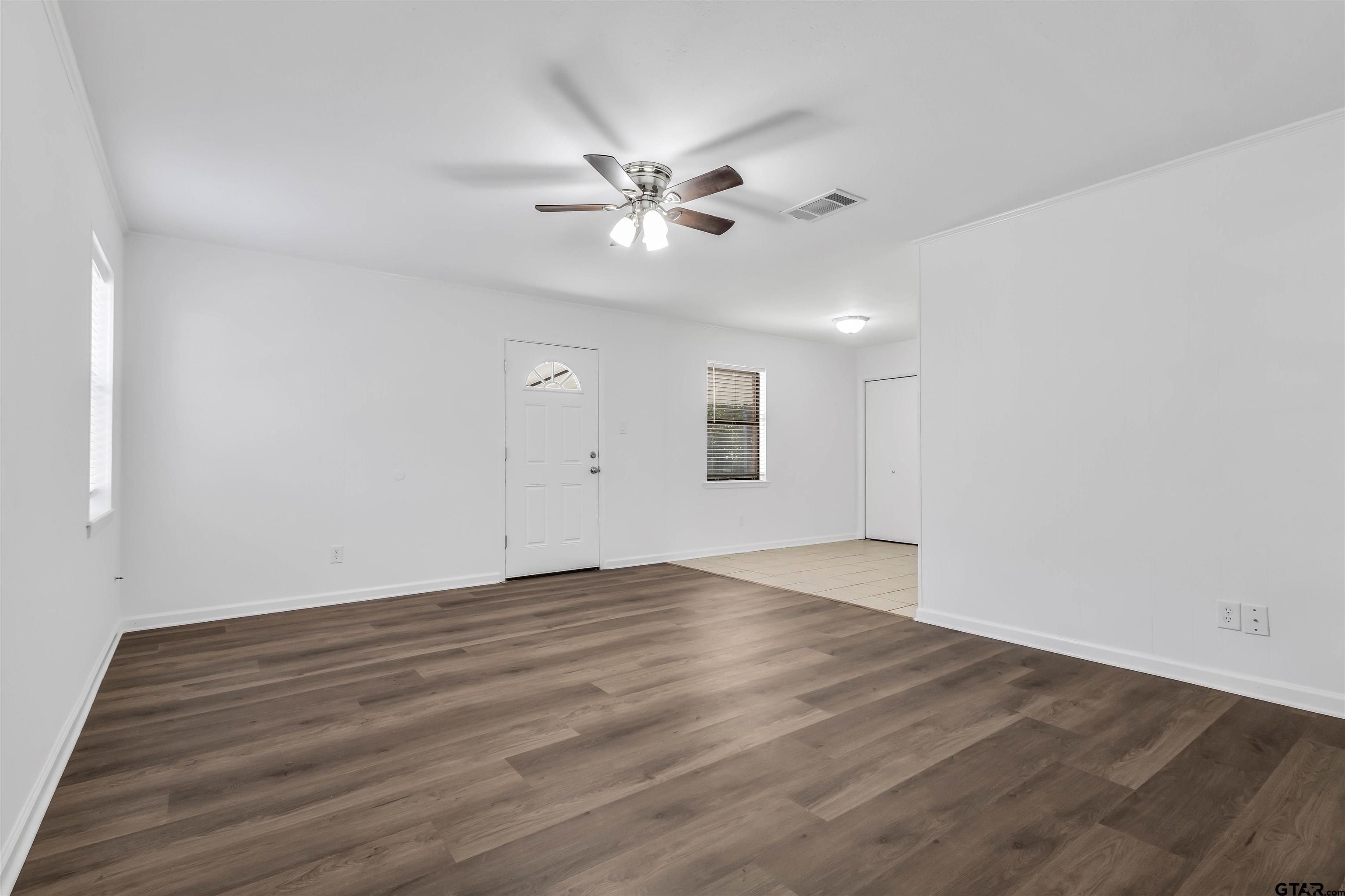 120 Laura Street Mineola, TX 75773 - Photo 12 of 27 wooden floor in an empty room