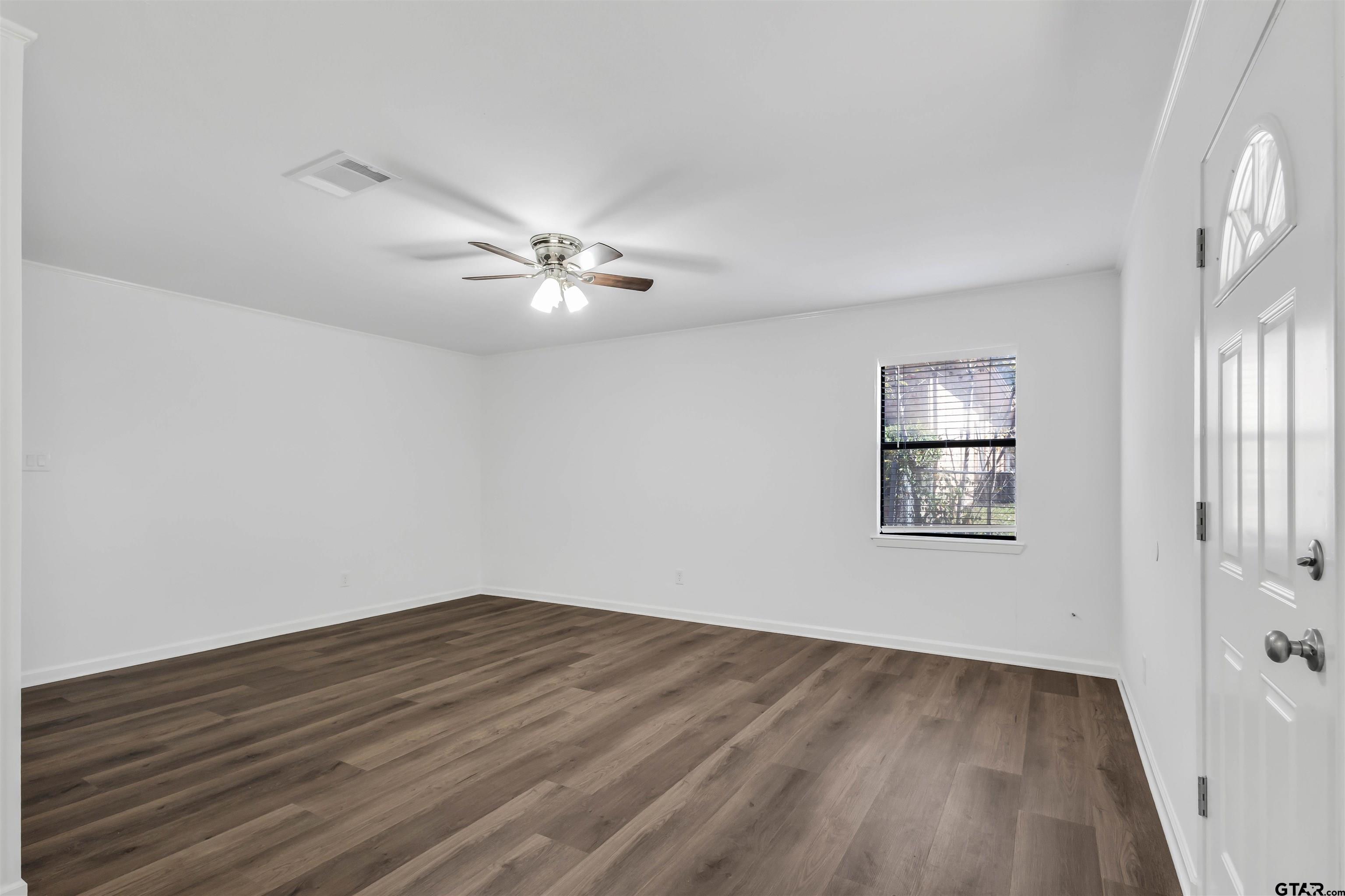 120 Laura Street Mineola, TX 75773 - Photo 15 of 27 a view of empty room with wooden floor