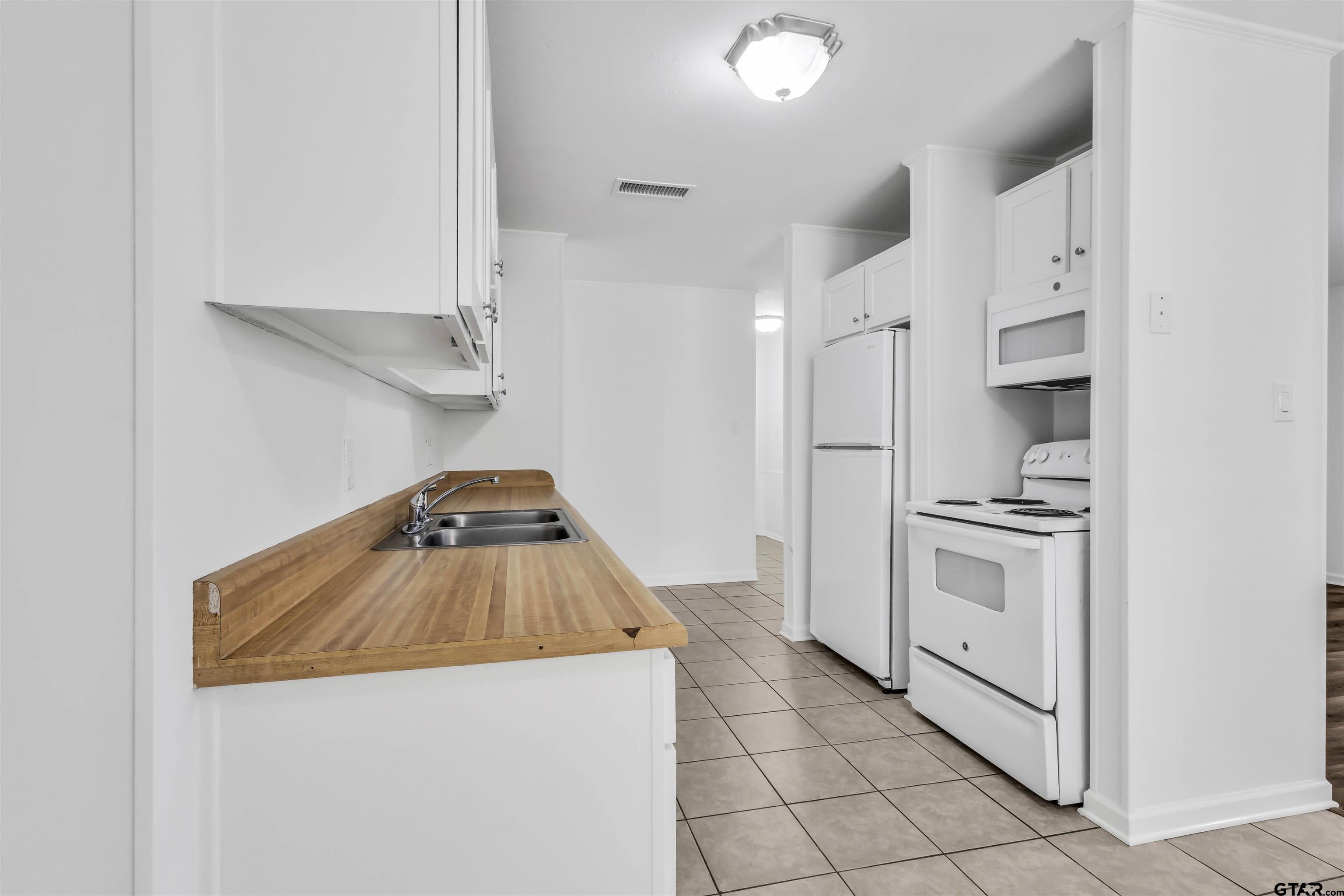 120 Laura Street Mineola, TX 75773 - Photo 16 of 27 a kitchen that has a sink and a stove