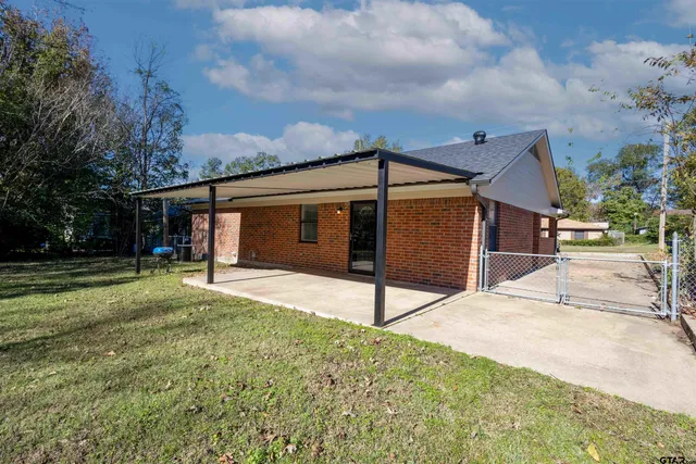 a house view with a backyard space