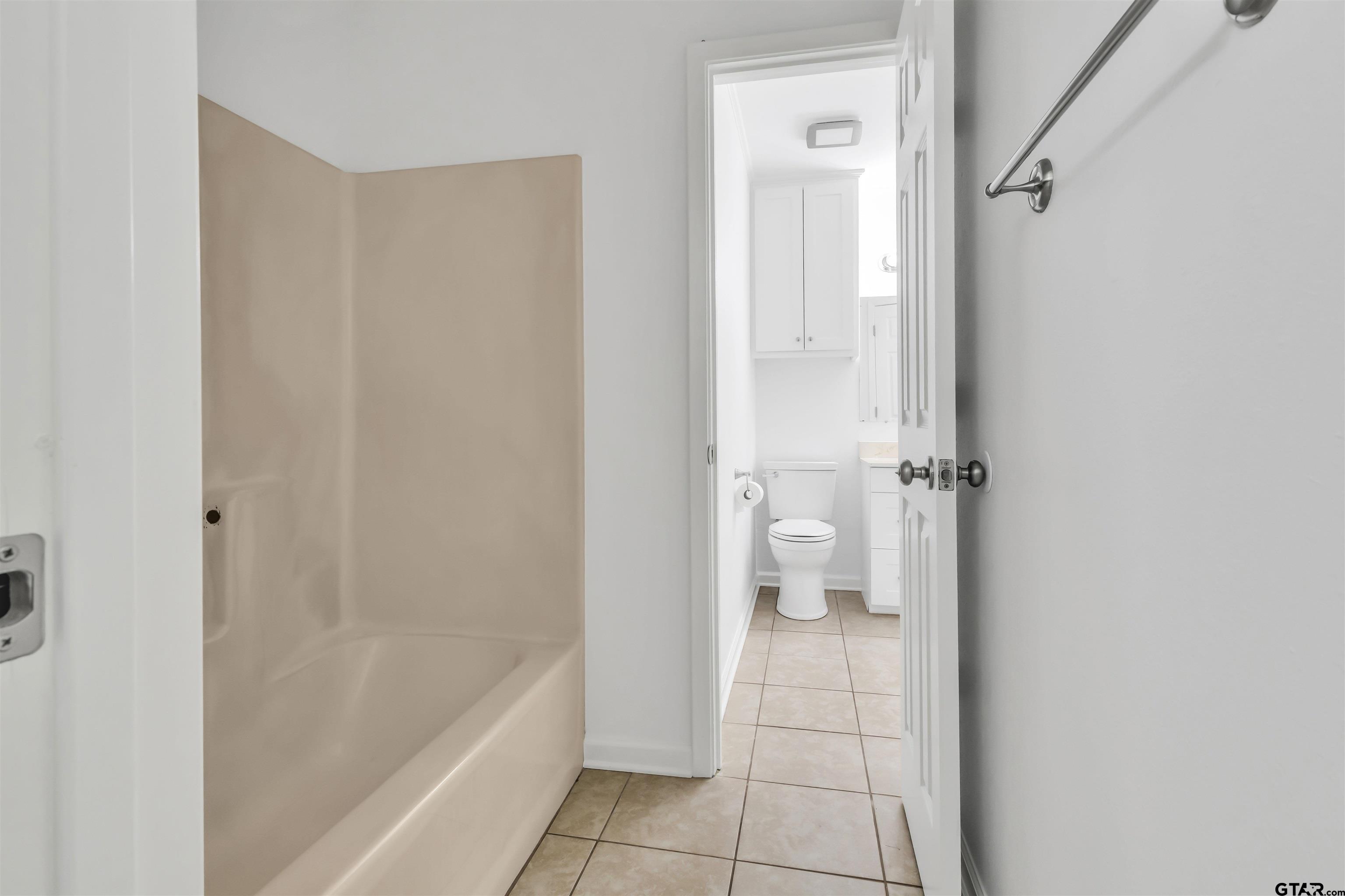 120 Laura Street Mineola, TX 75773 - Photo 25 of 27 a bathroom with a bathtub and a shower