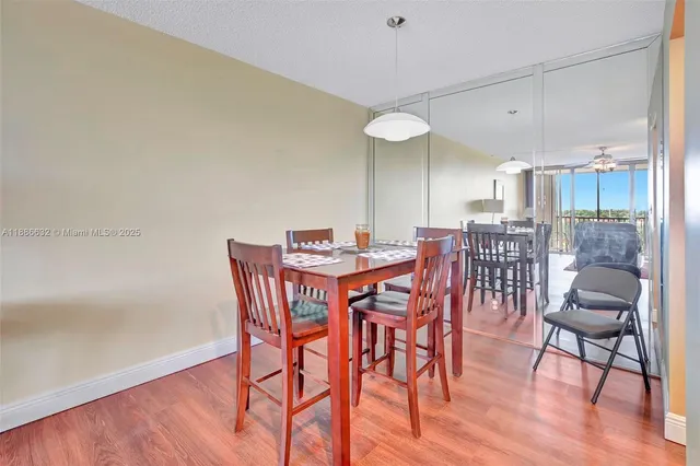 a bedroom with a bed and a lamp on the dresser