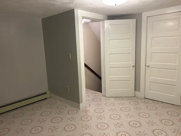 an empty room with a sink