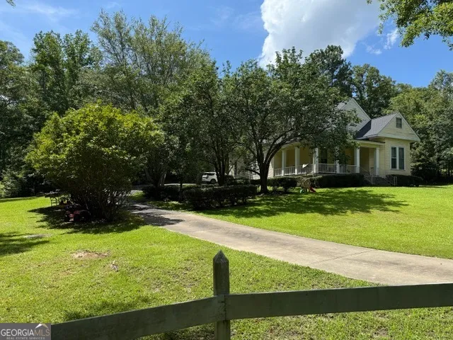 a view of house with outdoor space