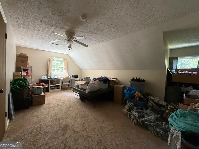 a living room with furniture fireplace and flat screen tv