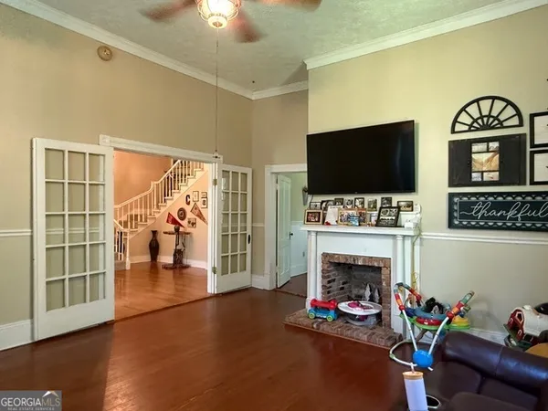 a view of a porch with a table and chairs and wooden floor