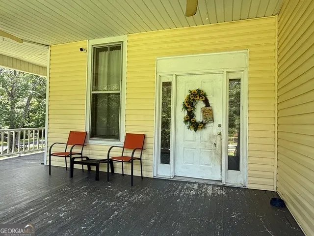 a view of a swimming pool with an outdoor space and seating area