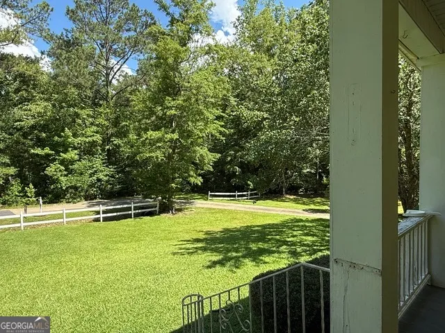 a view of swimming pool from a balcony