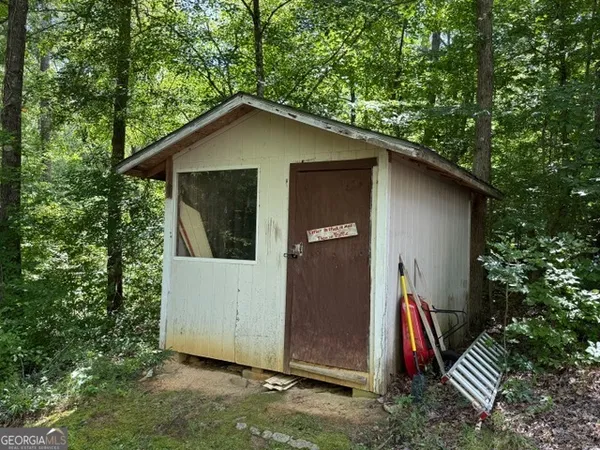 a house with trees in the background