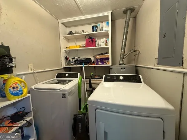 a utility room with dryer and washer