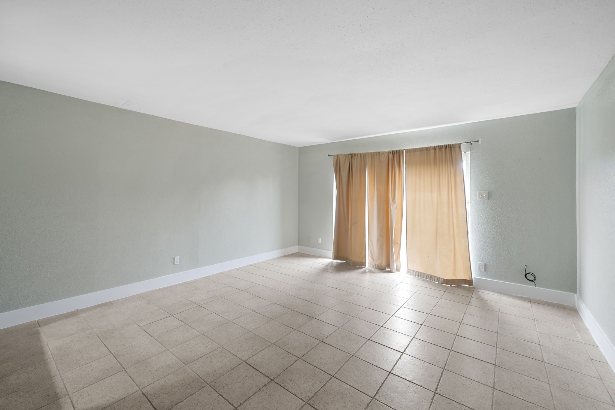 11550 Chimney Rock Road, Unit 521 Houston, TX 77035 - Photo 11 of 30 a view of an empty room with a window