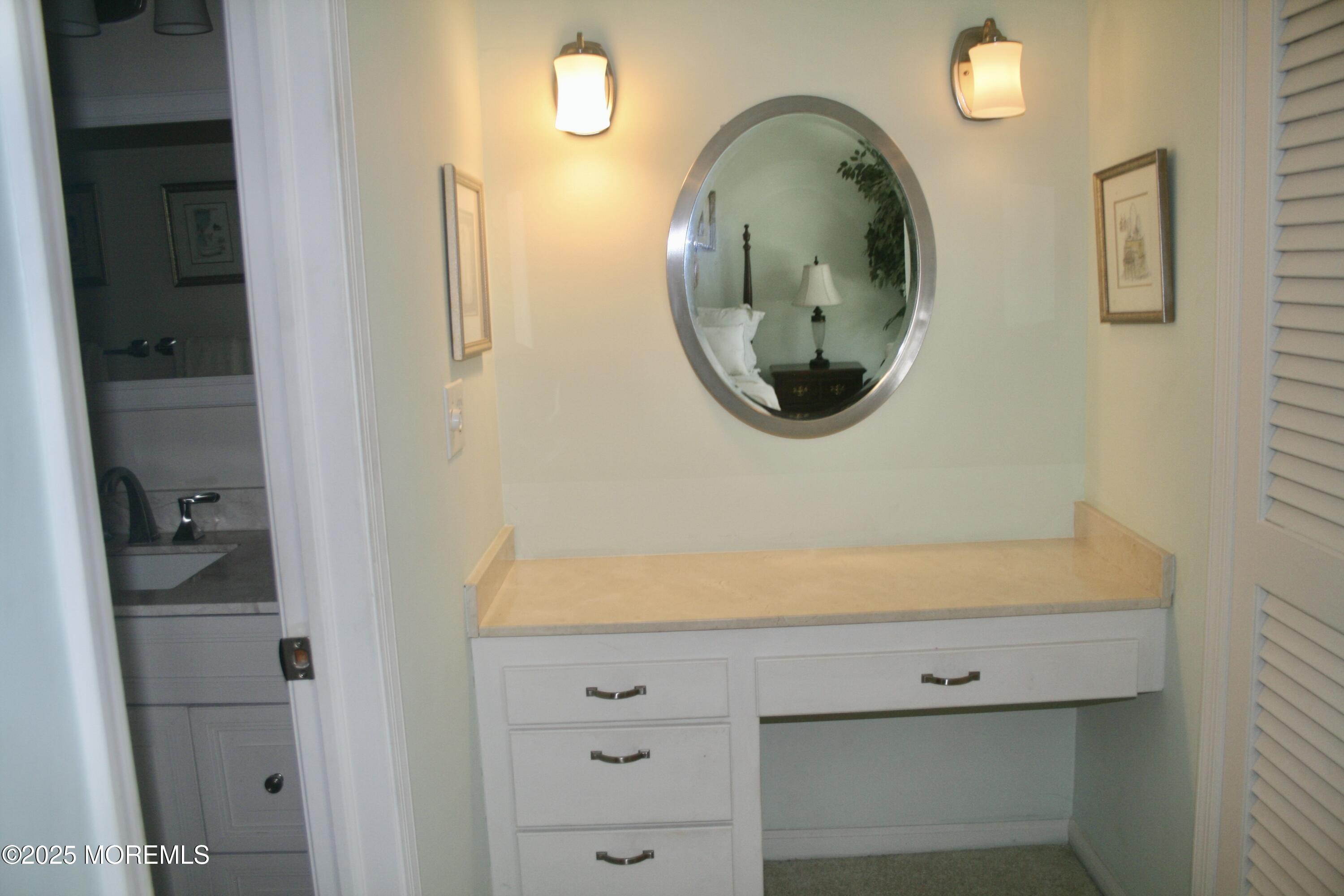 35 Apple Drive Spring Lake Heights, NJ 07762 - Photo 13 of 23 a bathroom with a sink and a mirror